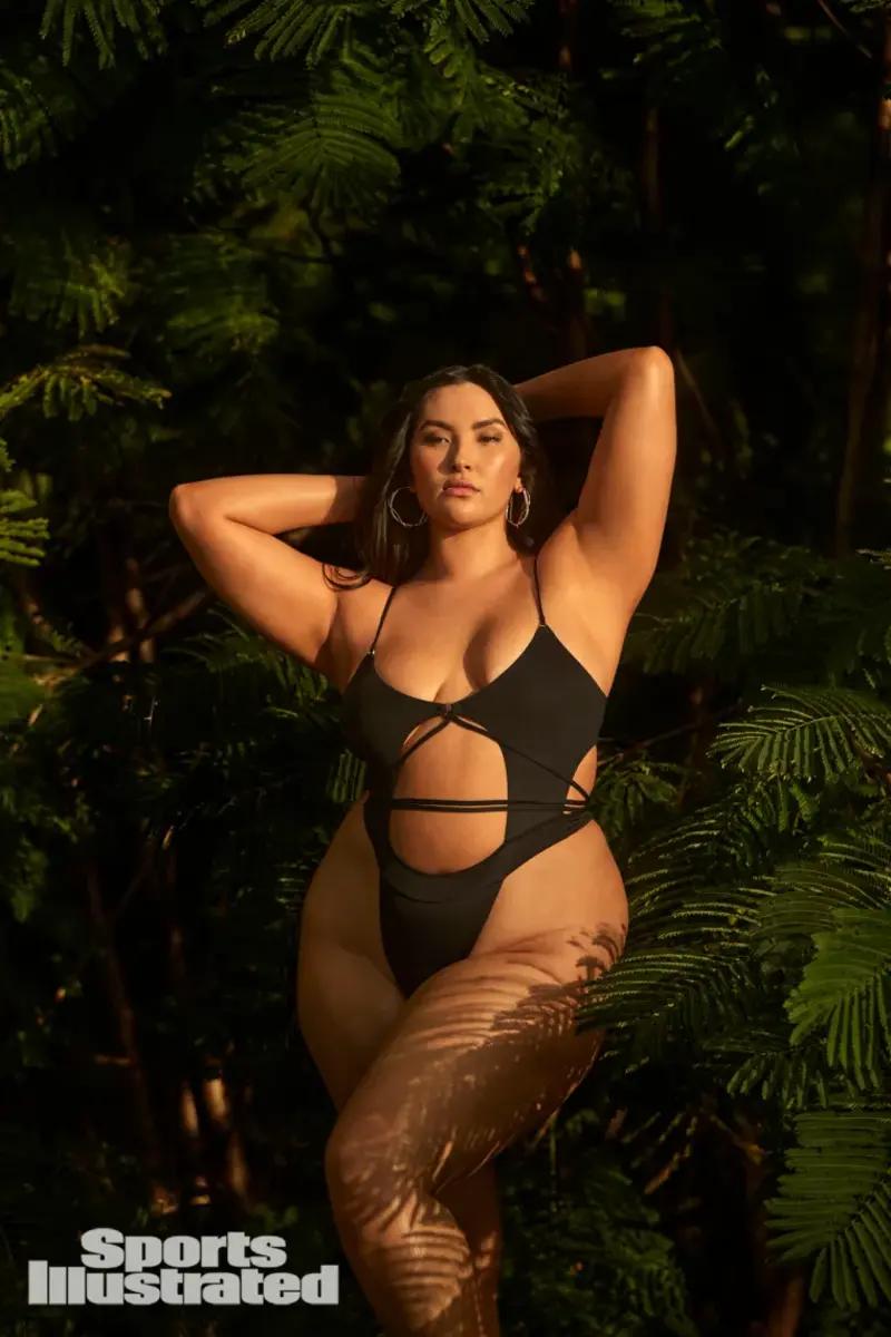 Yumi Nu was photographed by Amanda Pratt in Dominica. Swimsuit by Bad N Bare. Earrings by Alexis Bittar.